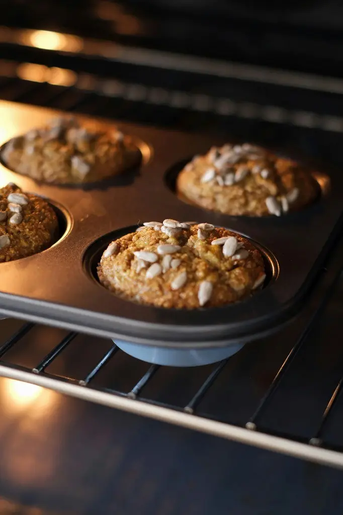 Sunflower seed muffins baking in a tin fresh from the oven